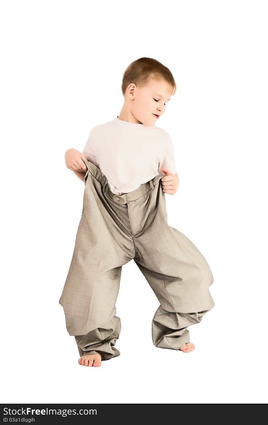 This photograph shows a boy in father's trousers