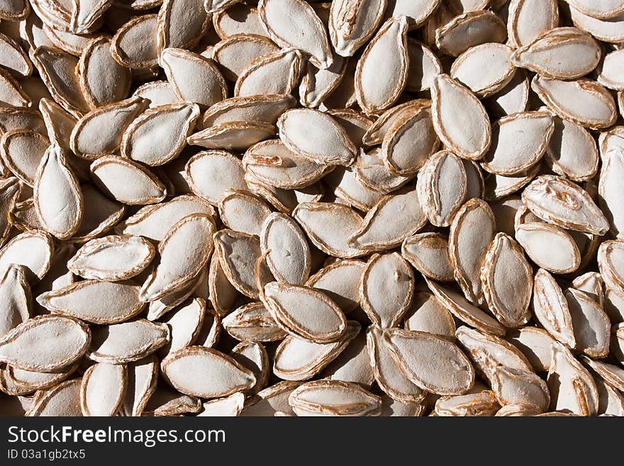 Real raw pumpkin seeds background