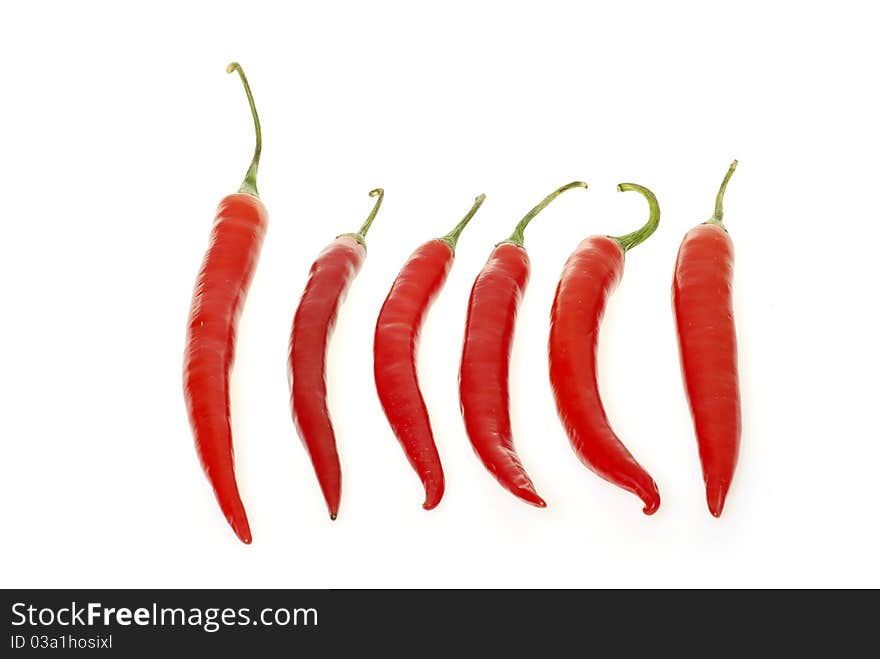 Red hot chili peppers on white background