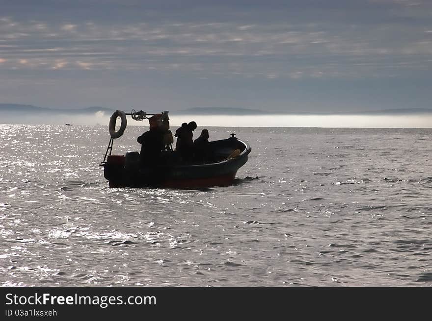 Fishermen In Their Boat