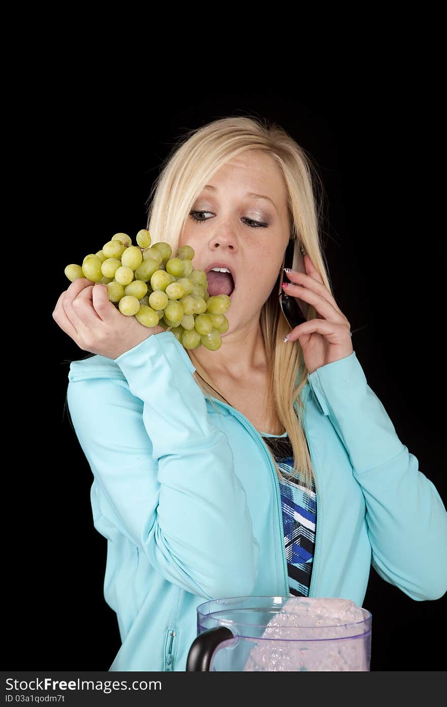 Woman On Phone Eating Grapes