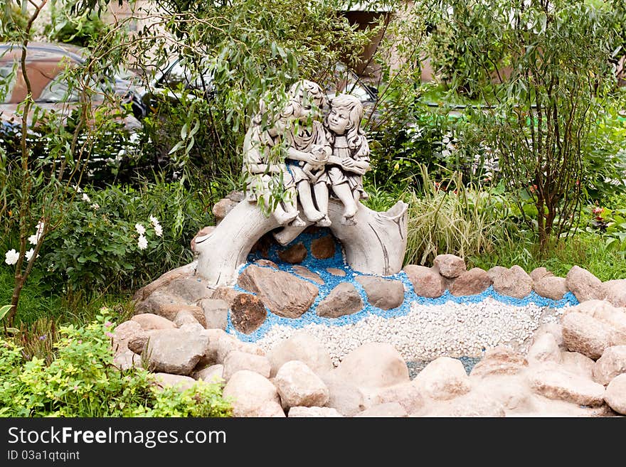 A statues in a summer garden. A statues in a summer garden