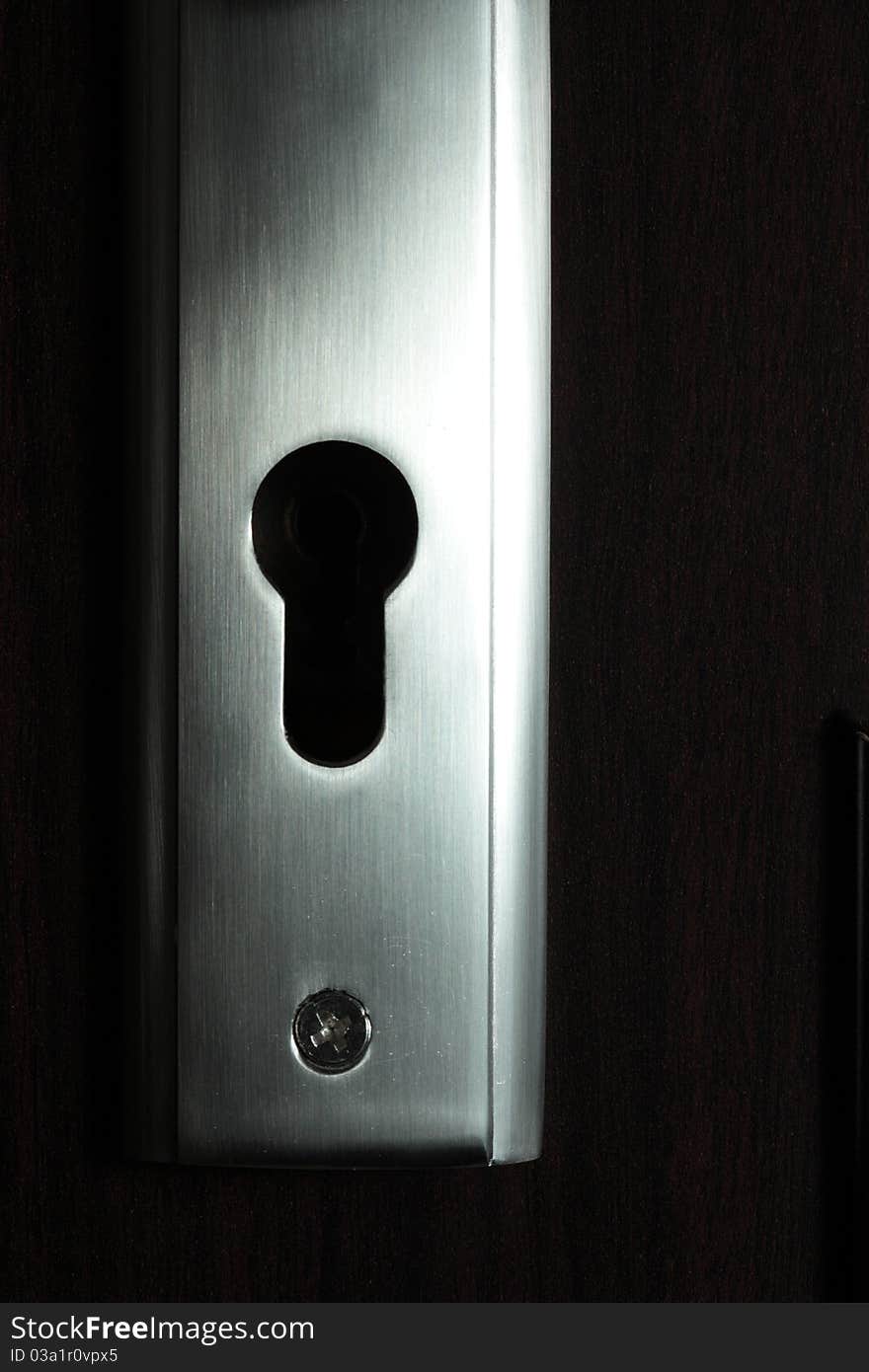 Door keyhole dark background, nobody