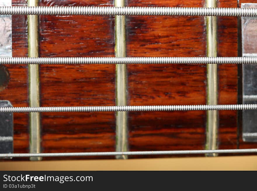 Wooden electrical bass guitar background