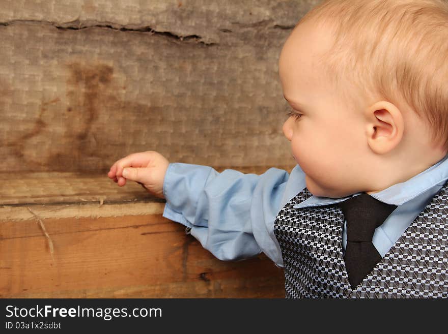 Baby boy playing inside an antique trunk. Baby boy playing inside an antique trunk