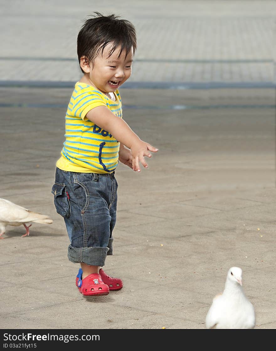 A baby is playing in a park. A baby is playing in a park