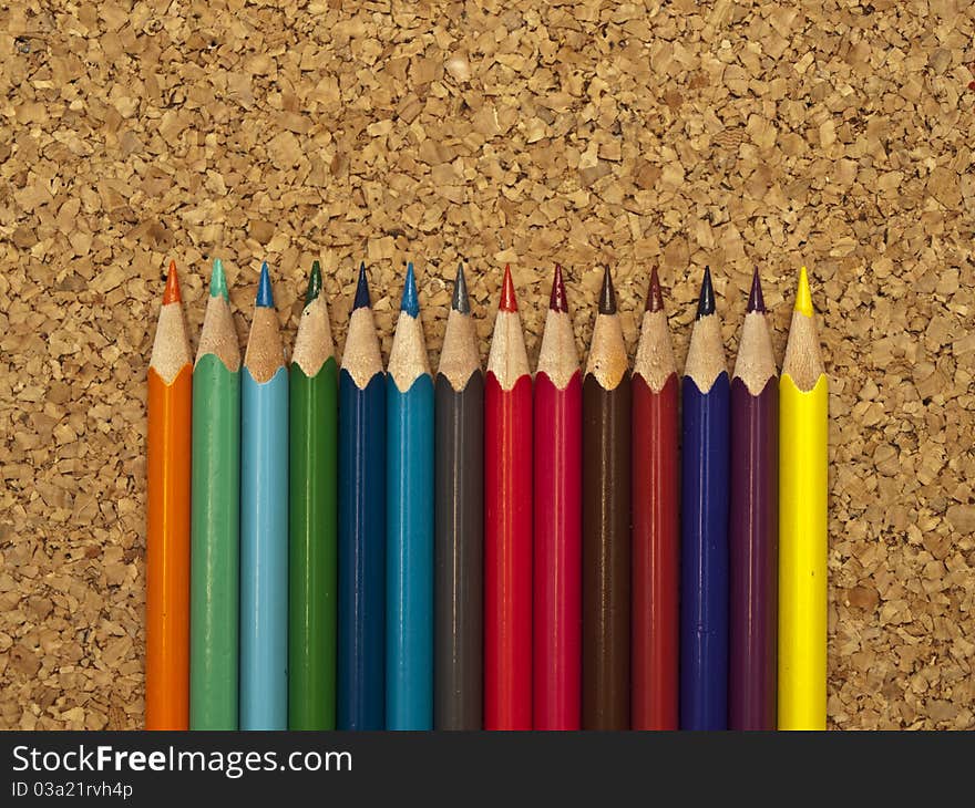 Colored pencils on a folder. Colored pencils.