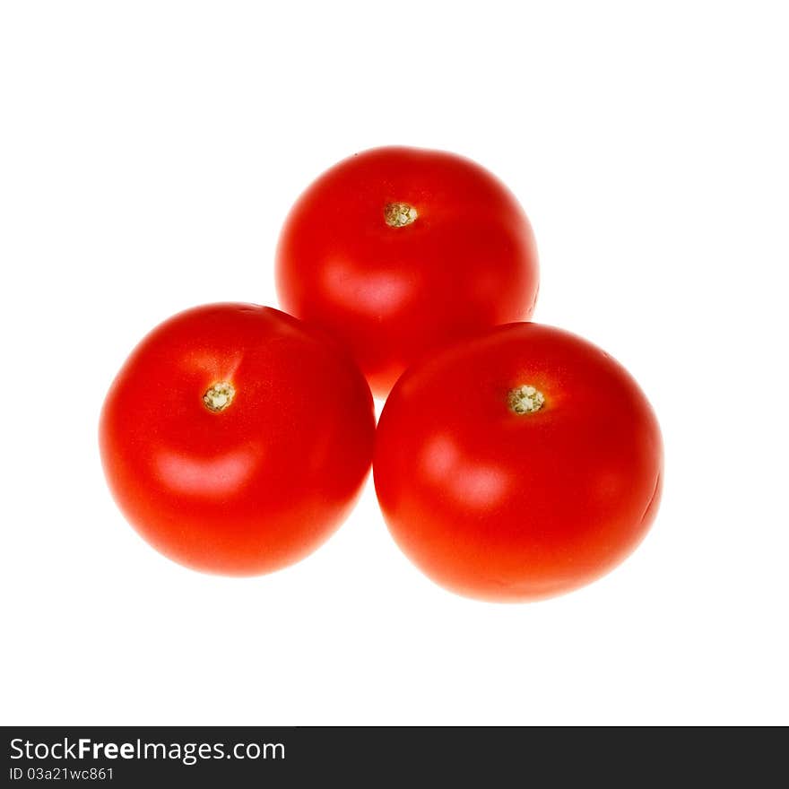 Three fresh tomatoes  (isolated).