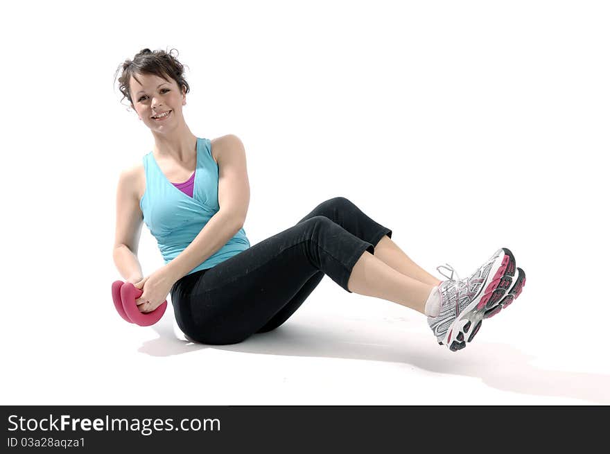 Young pretty woman exercises isolated on white background. Young pretty woman exercises isolated on white background.