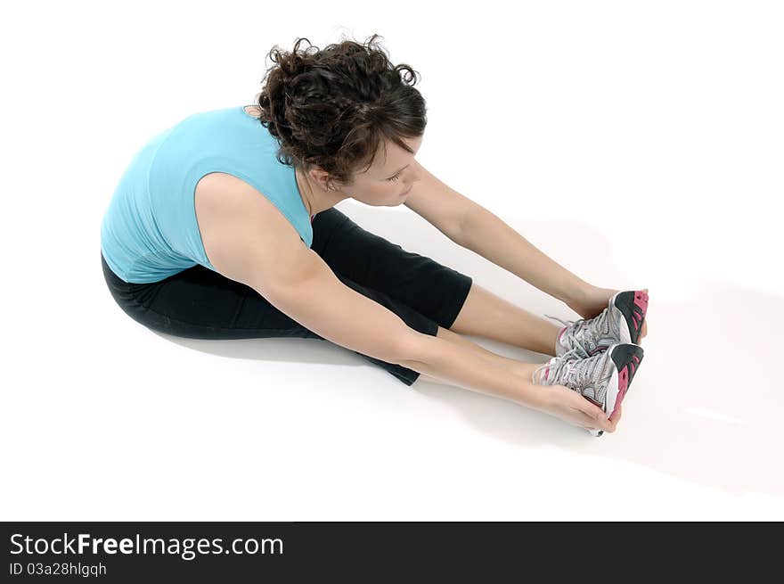 Young pretty woman exercises isolated on white background. Young pretty woman exercises isolated on white background.