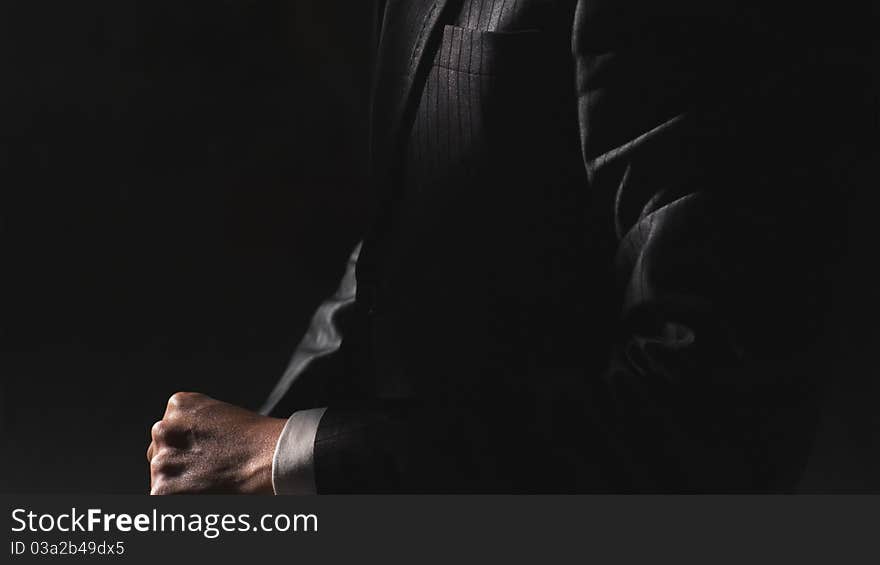 Closeup of a Chinese businessman before black background. Closeup of a Chinese businessman before black background