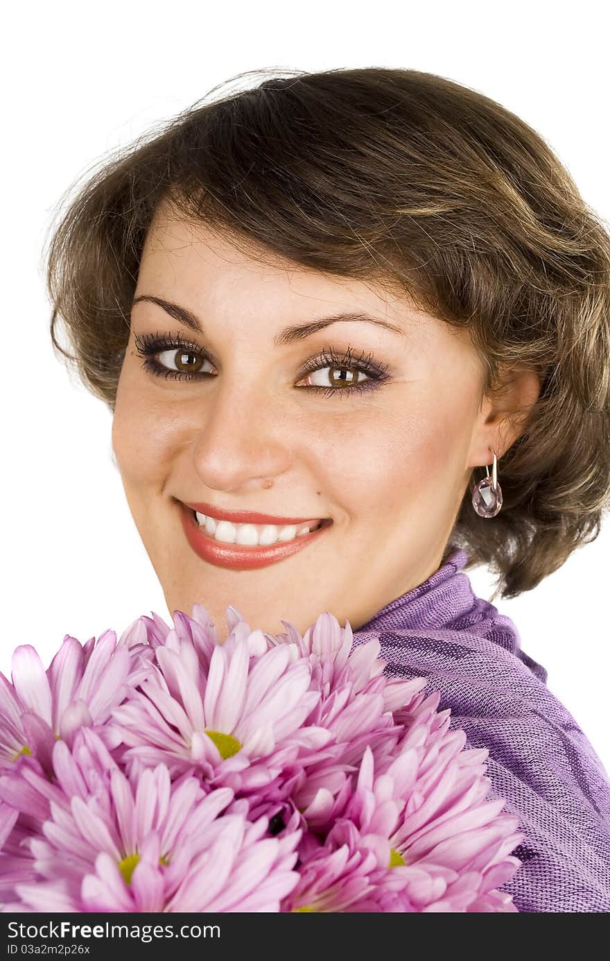 Attractive young woman face in purple scarf with pink flowers isolated on the white. Attractive young woman face in purple scarf with pink flowers isolated on the white.