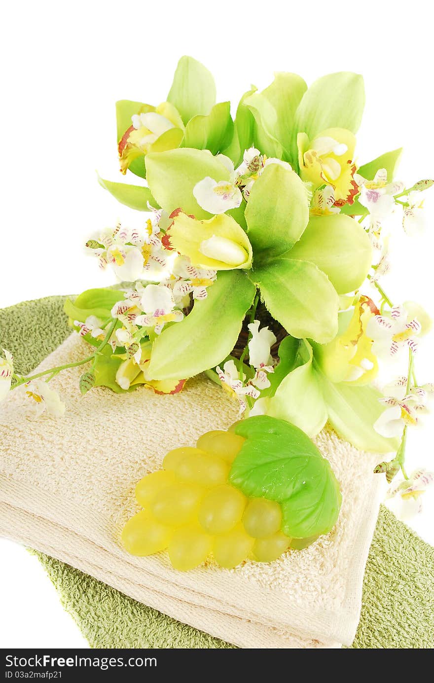 Natural green  grape soap and orchid flower isolated on white background. Natural green  grape soap and orchid flower isolated on white background.