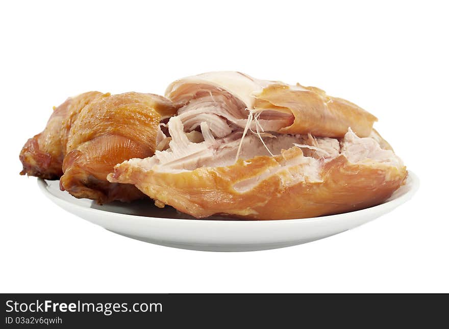 Smoked chicken in a dish on a white background