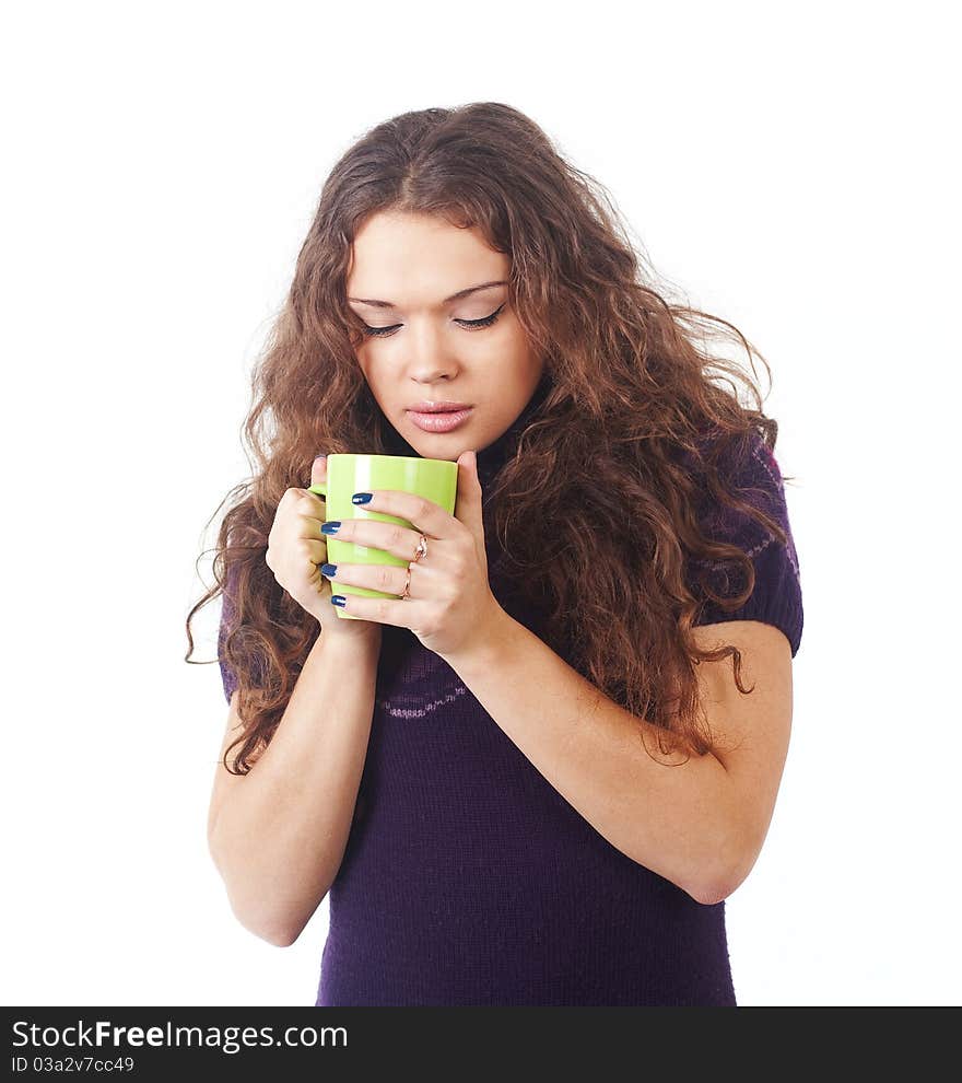 Young beautiful woman with a green cup