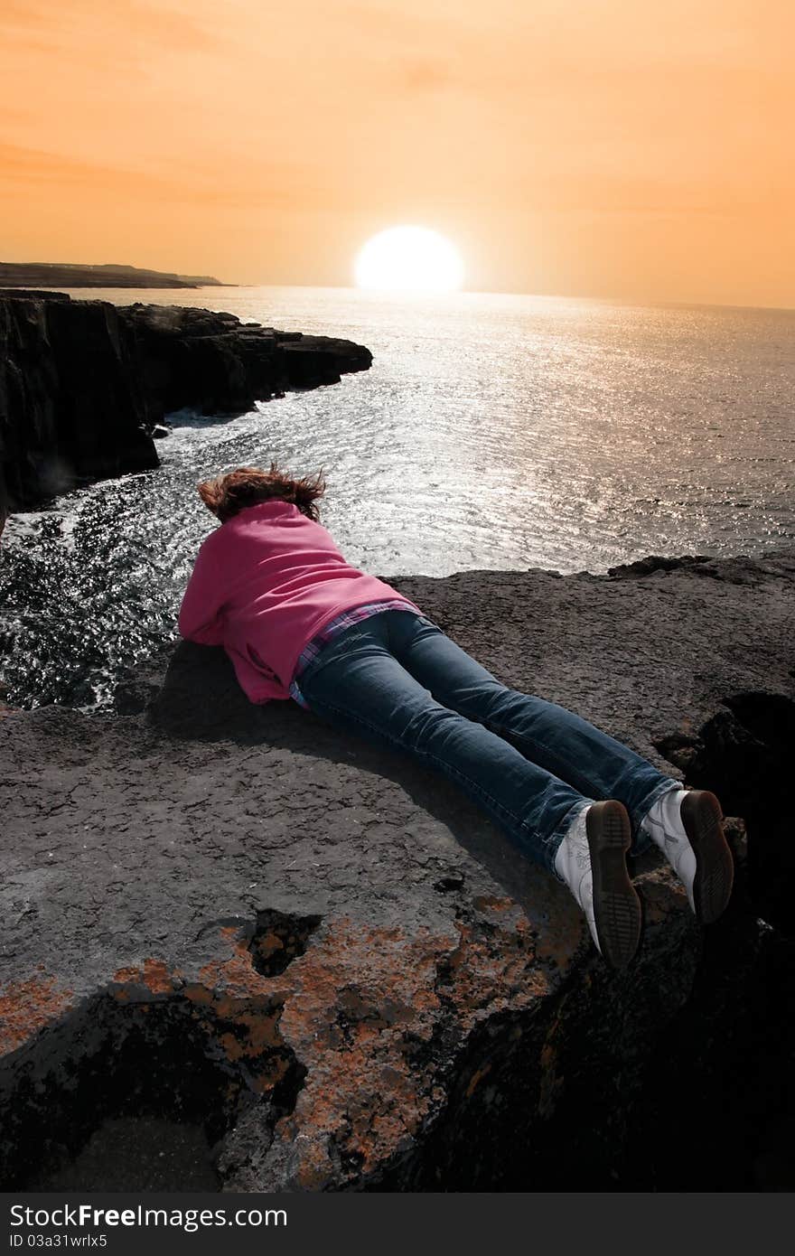 Lone Woman On Cliffs Edge