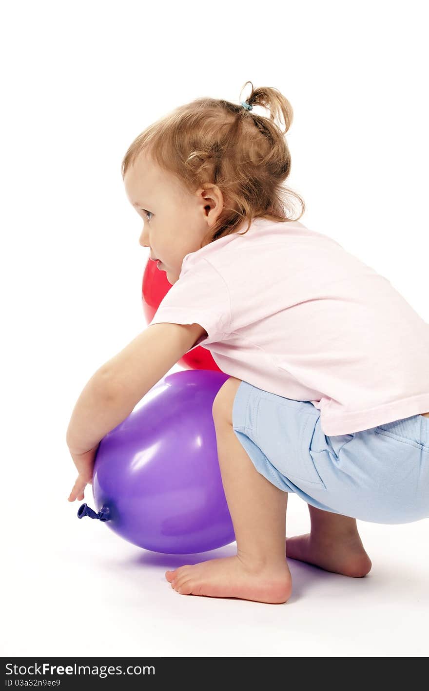 Little girl is playing with balloons in studio. Little girl is playing with balloons in studio