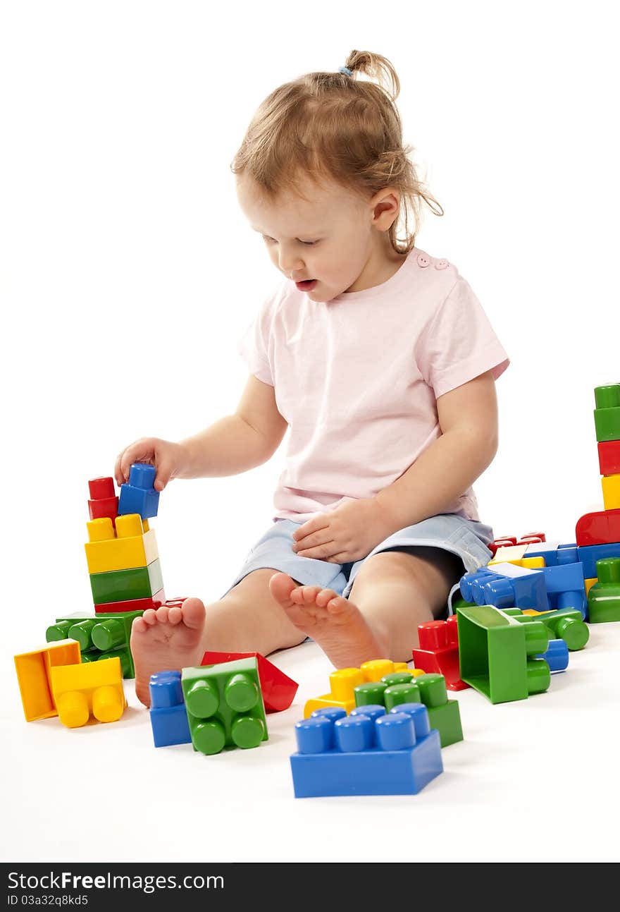 Baby In Studiu Is Playing With Block