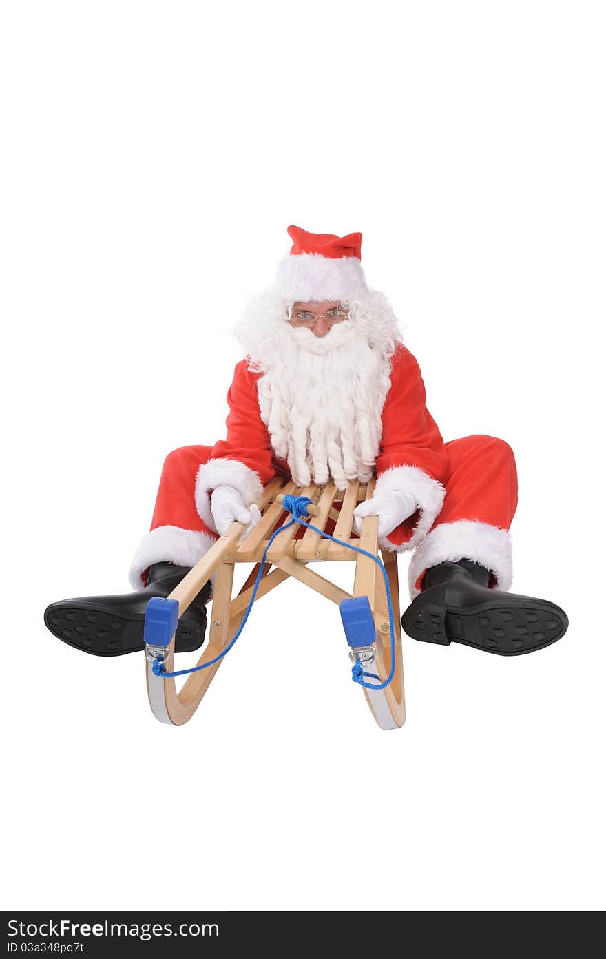 Funny santa on sledge in studio. Funny santa on sledge in studio