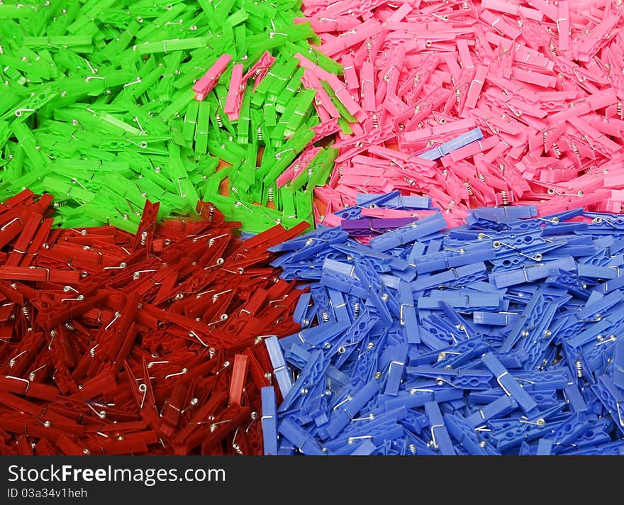 Colored washing line pegs on a market stall table