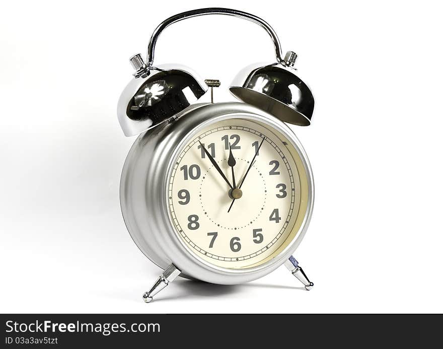 Photo of a retro alarm clock in white background