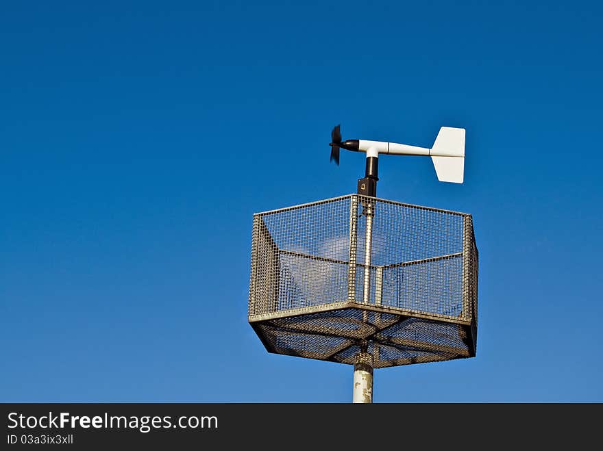 Anemometer against blue sky