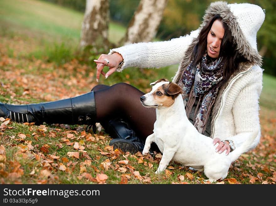 Woman with her dog is pointing