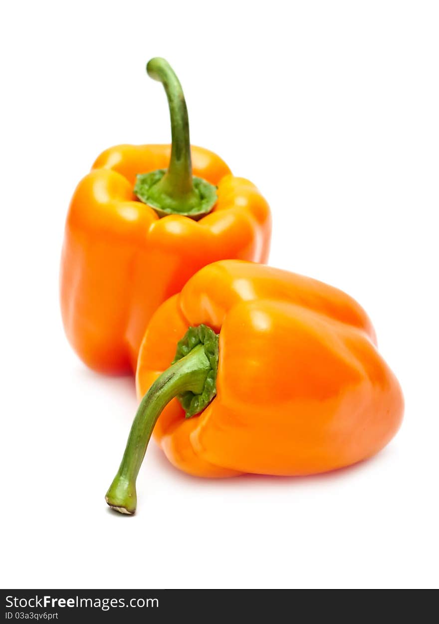 Orange peppers isolated on white background