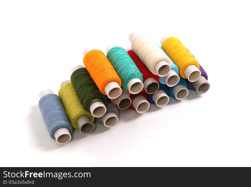 Colored thread on a white background. Colored thread on a white background.