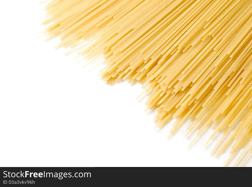 Uncooked spaghetti close-up on a white background