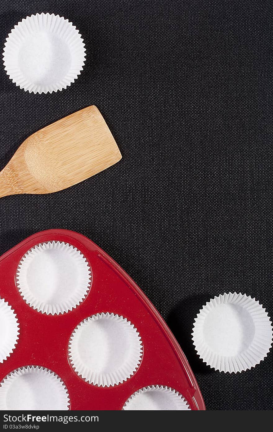 Silicone bakeware red with paper cups for baking.