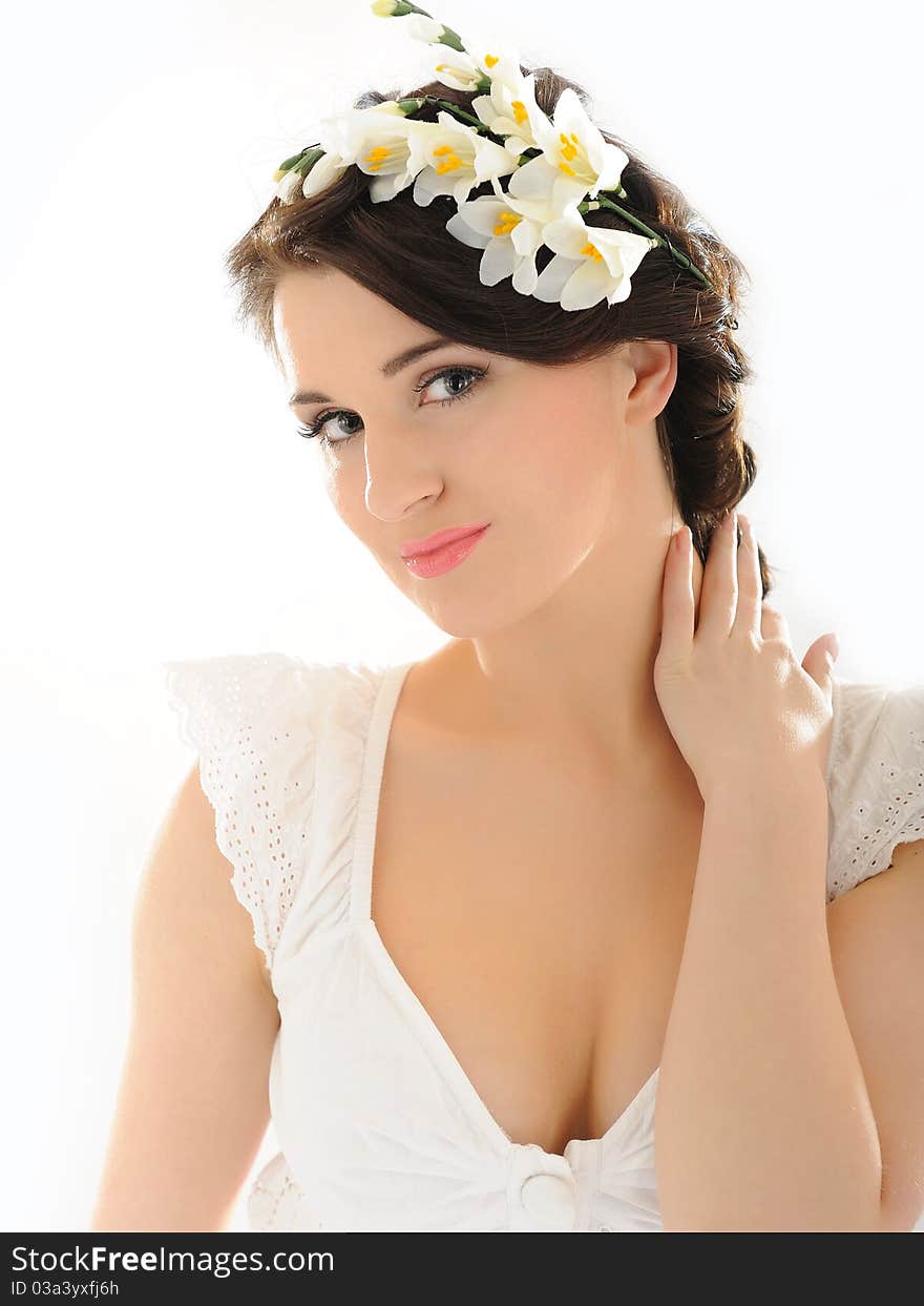 Beautiful fresh spring woman with flowers in her hair