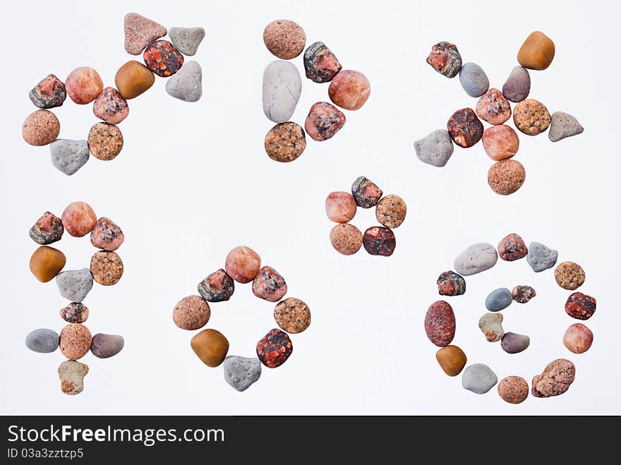 Set of signs and bullet points made of pebble on white background.