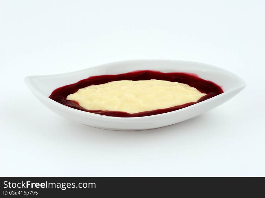 Dessert with strawberry cream on a white plate. Dessert with strawberry cream on a white plate