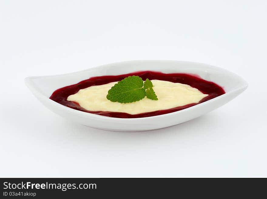 Dessert with strawberry cream on a white plate. Dessert with strawberry cream on a white plate