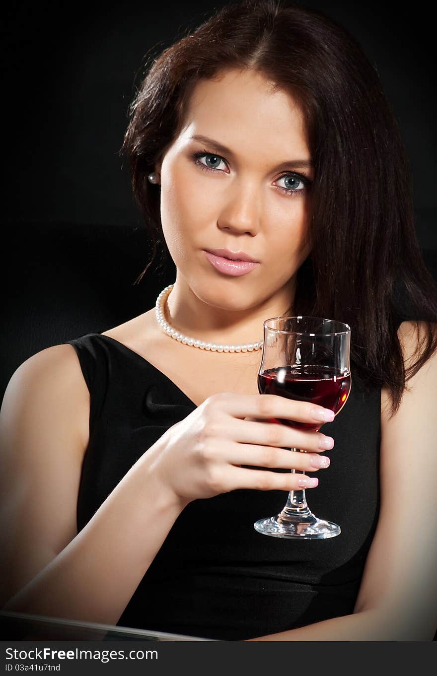 Brunette with a glass of wine