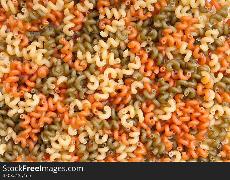 Background texture of colorful pasta