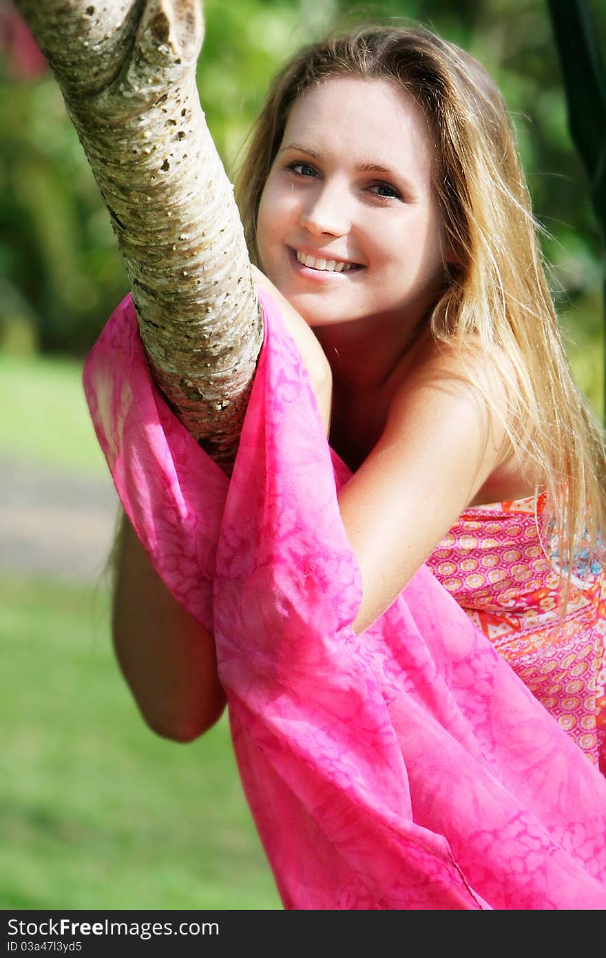 Young beautiful woman relaxing on natural background