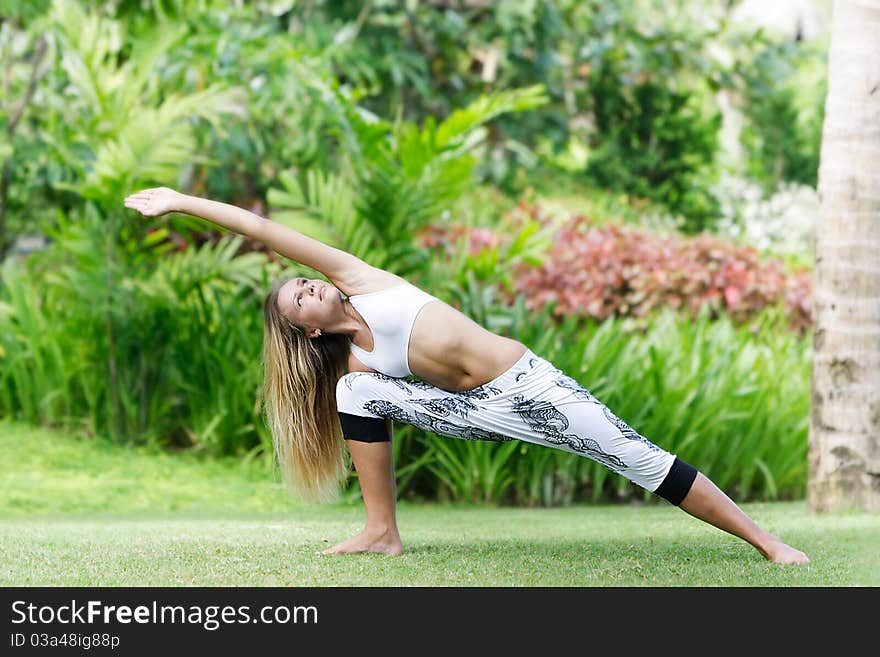 Woman doing yoga on natural background