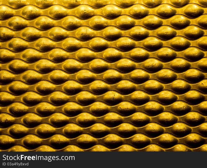 A close up yellow metallic for background use. A close up yellow metallic for background use