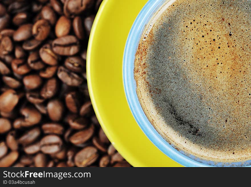 Coffee beans and cup