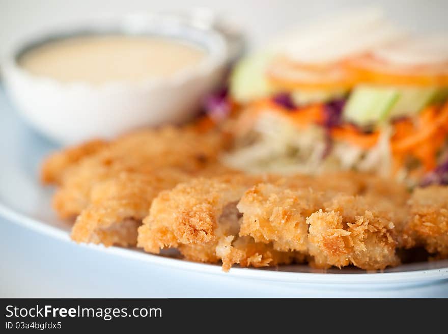 Batter-fried pork salad show as shallow depth of field photograph technical