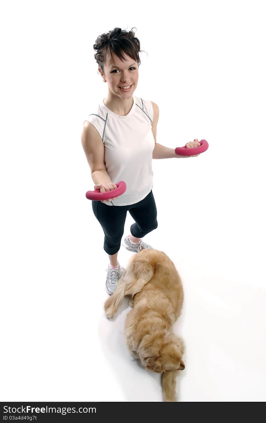 Young pretty woman plays with her dog