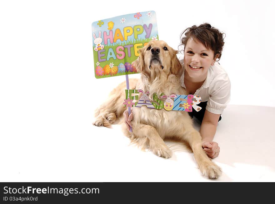 Young pretty woman and her dog hold Easter sign. Young pretty woman and her dog hold Easter sign.