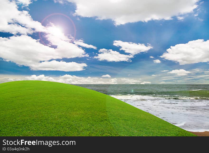 Beautiful beach under the blue sky and green hill