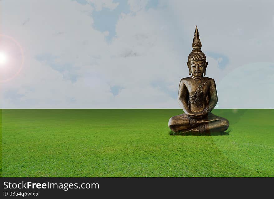 Image of Buddha in the green field