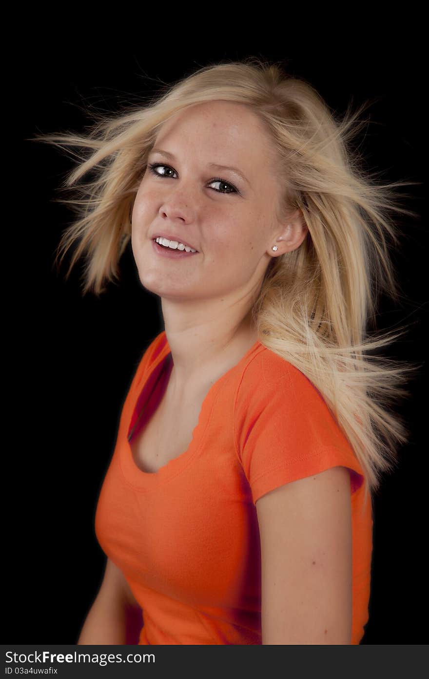 A portrait of a woman with her hair blowing. A portrait of a woman with her hair blowing