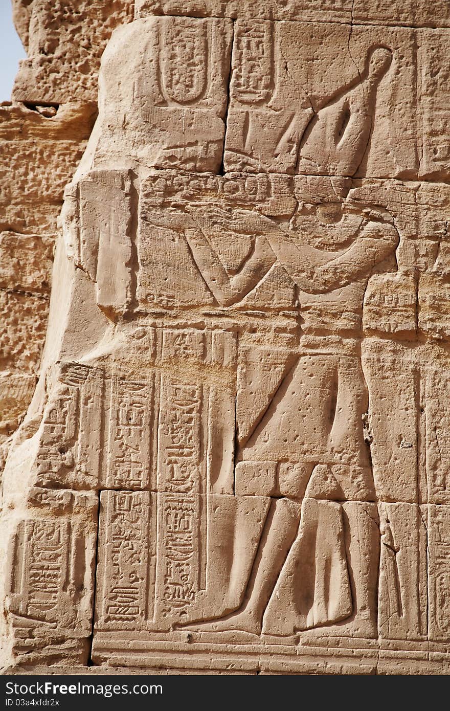 Egyptian images and hieroglyphs engraved on stone