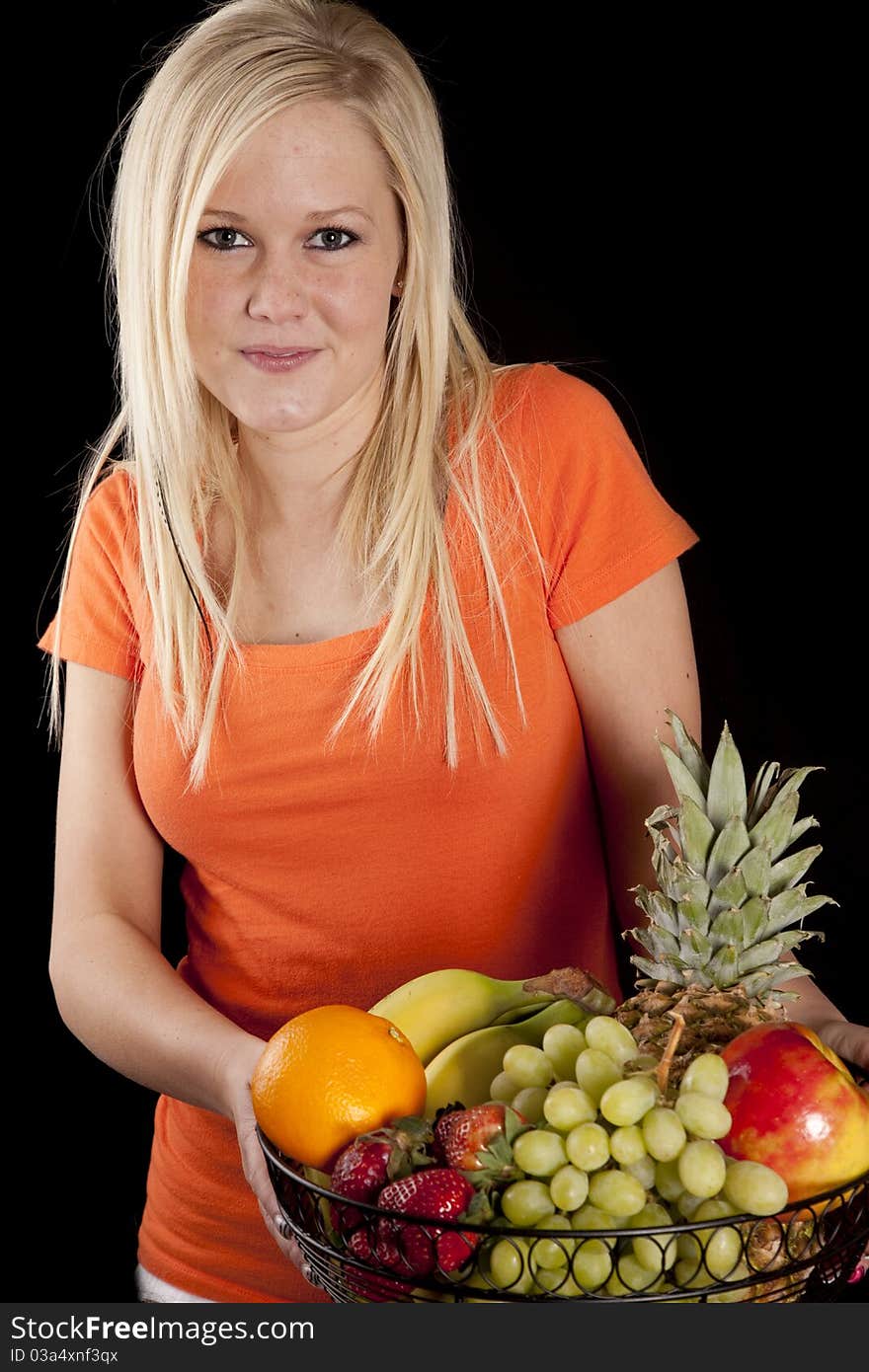 Woman in orange with fruit basket