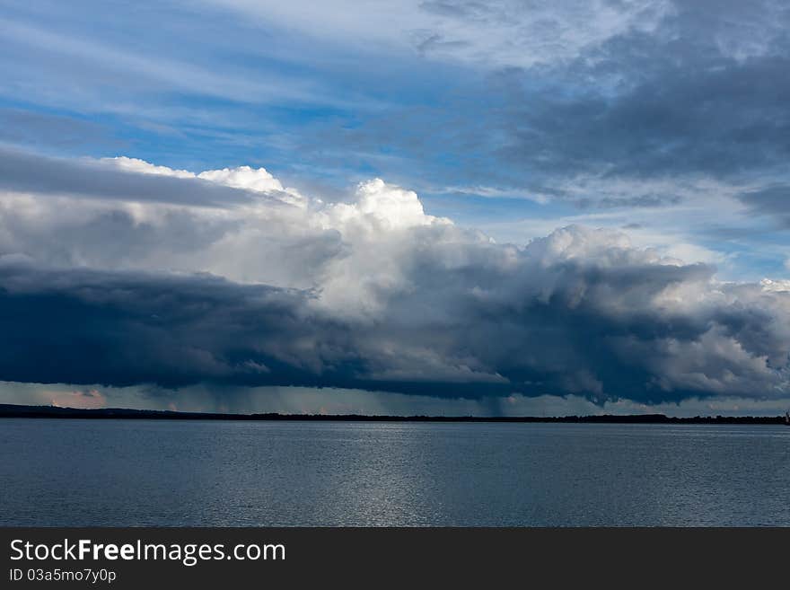 Big powerful storm clouds over the lake